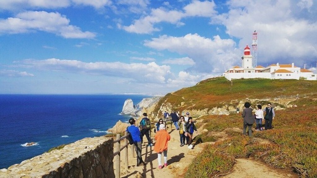 Cabo da Roca, landmark cross inscription "Land ends and the sea begins" Portuguese poet Luis Camões.