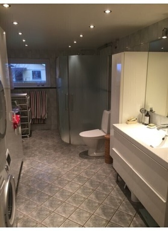 Bathroom with shower and laundry