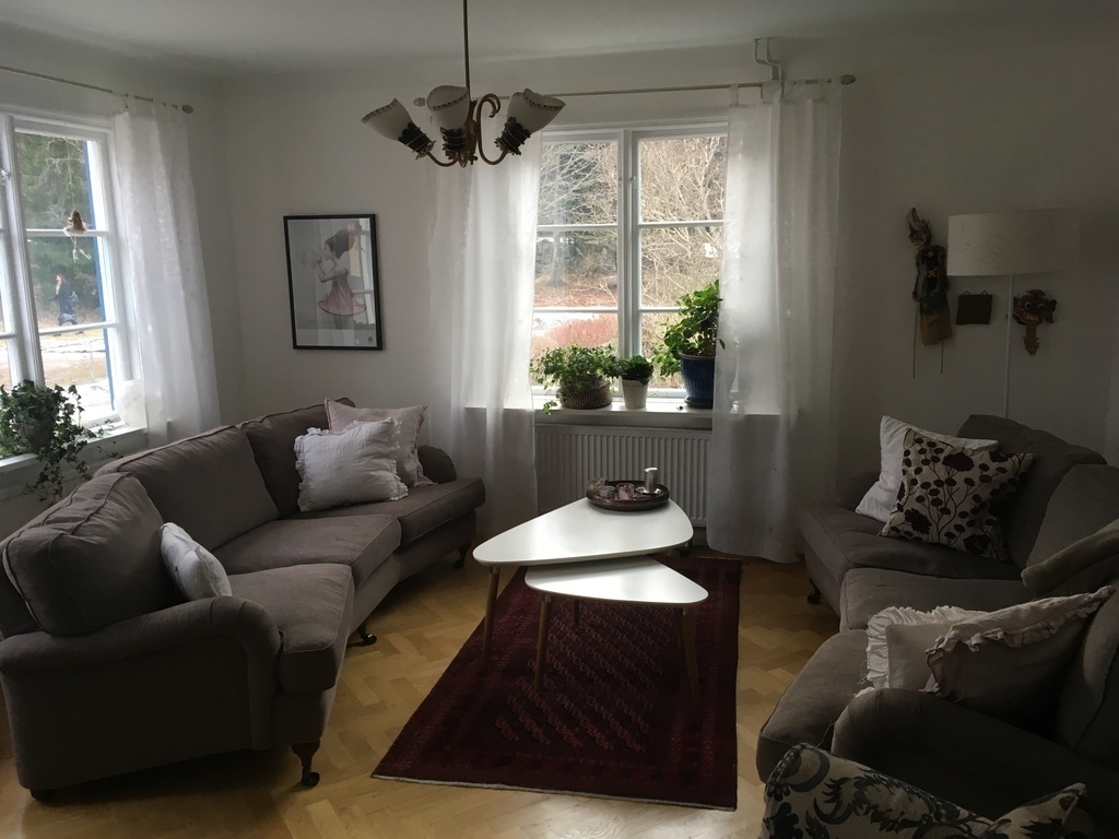 Large living room with TV and view towards Skogskyrkogården (world heritage by UNESCO)