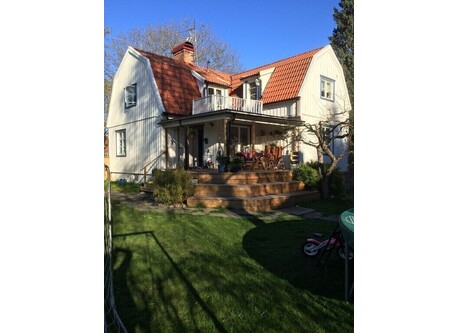 House and sunny garden all day long