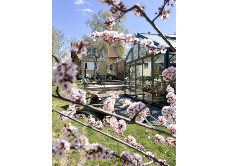 Exterior view of our house and greenhouse.