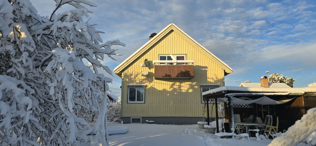 The house covered in snow