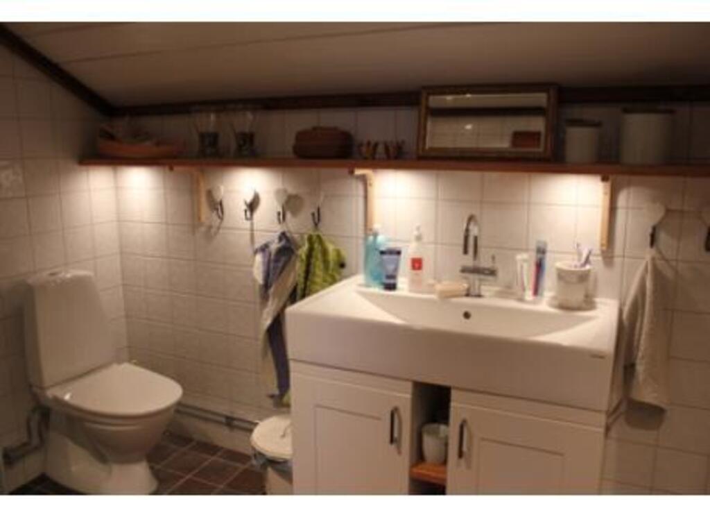 Bathroom with a shower upstairs