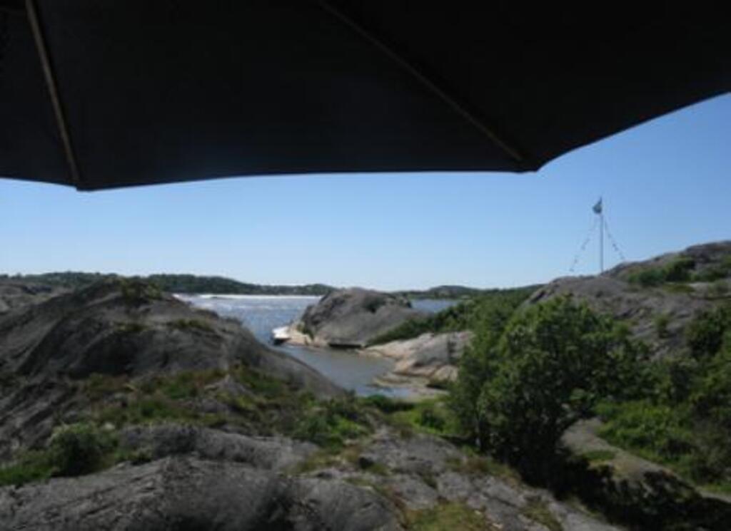 View towards west, from the baclony, overlooking the public "beach" at the end of the garden