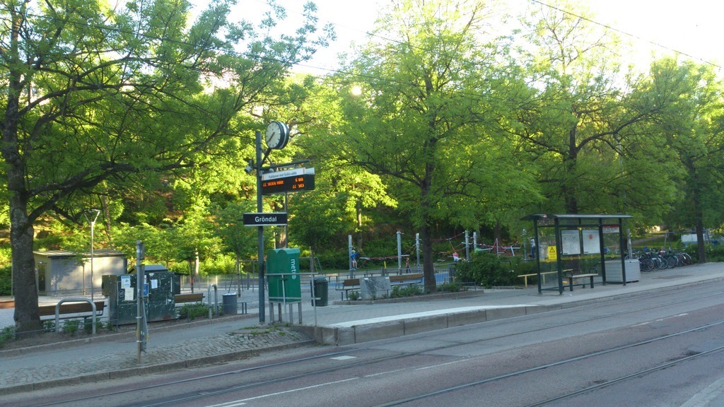 The station for bus and small blue trains "Tvärbanan" in Gröndal. Behind the new renovated park for small and large children.
