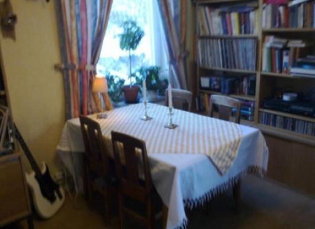 The living room with a table for 4 persons.