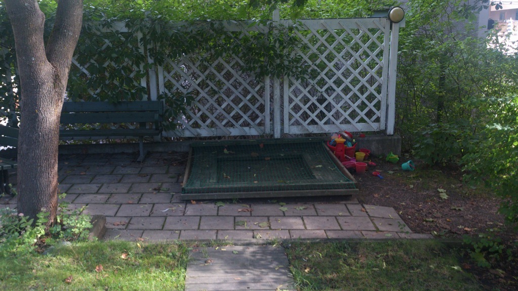 We have a sandpit for small children. The plastic red is on to keep the cats away. Between 2 trees you can hang our hamock fr...