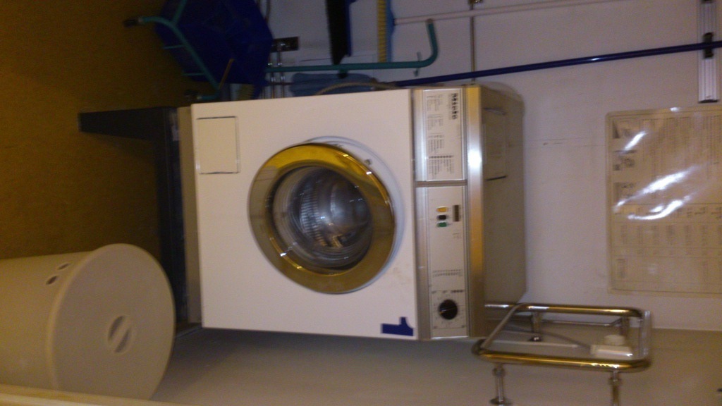 Washing machine downstairs on the first floor for 9 appartements and a dryer in the next room.