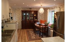 The kitchen: the hub of the house with a long sofa for relaxing/reading.