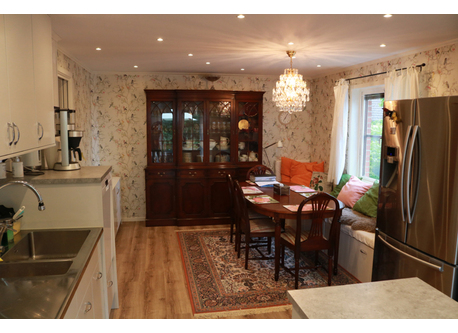 The kitchen: the hub of the house with a long sofa for relaxing/reading.