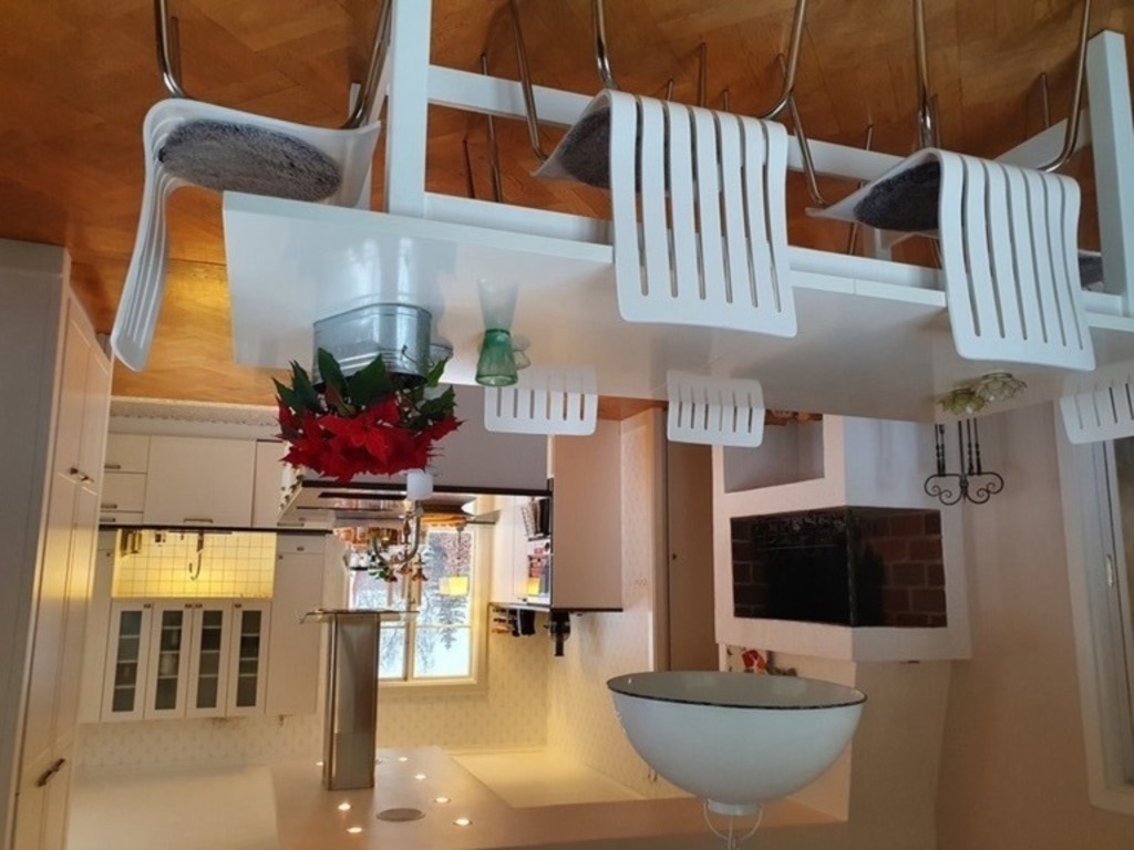 A combined kitchen and dining room with a fireplace