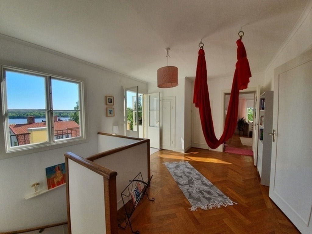 Upper hall with aerial silk and a view of Lake Mälaren.
