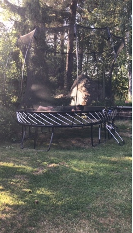 Trampoline in garden 