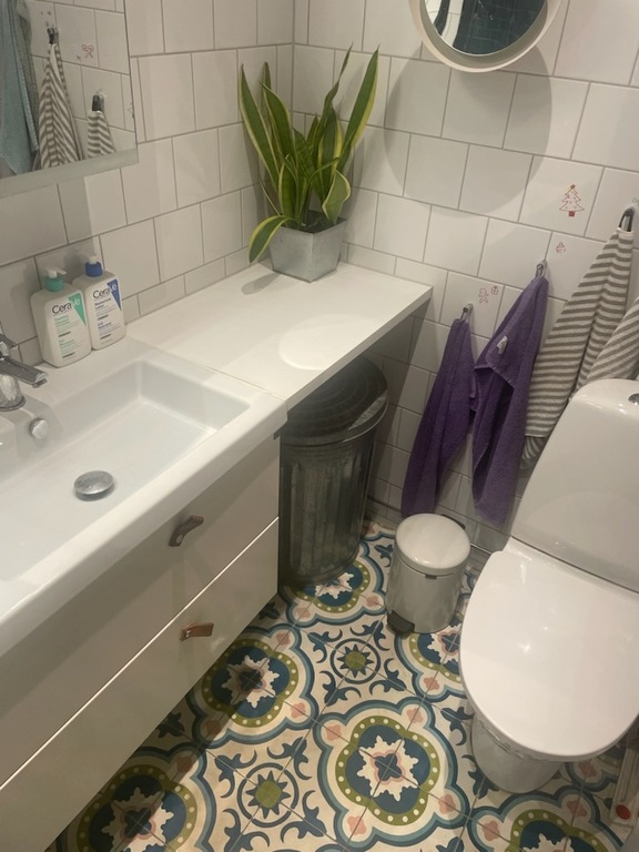 The bigger bathroom has a shower. There is also a smaller bathroom. 