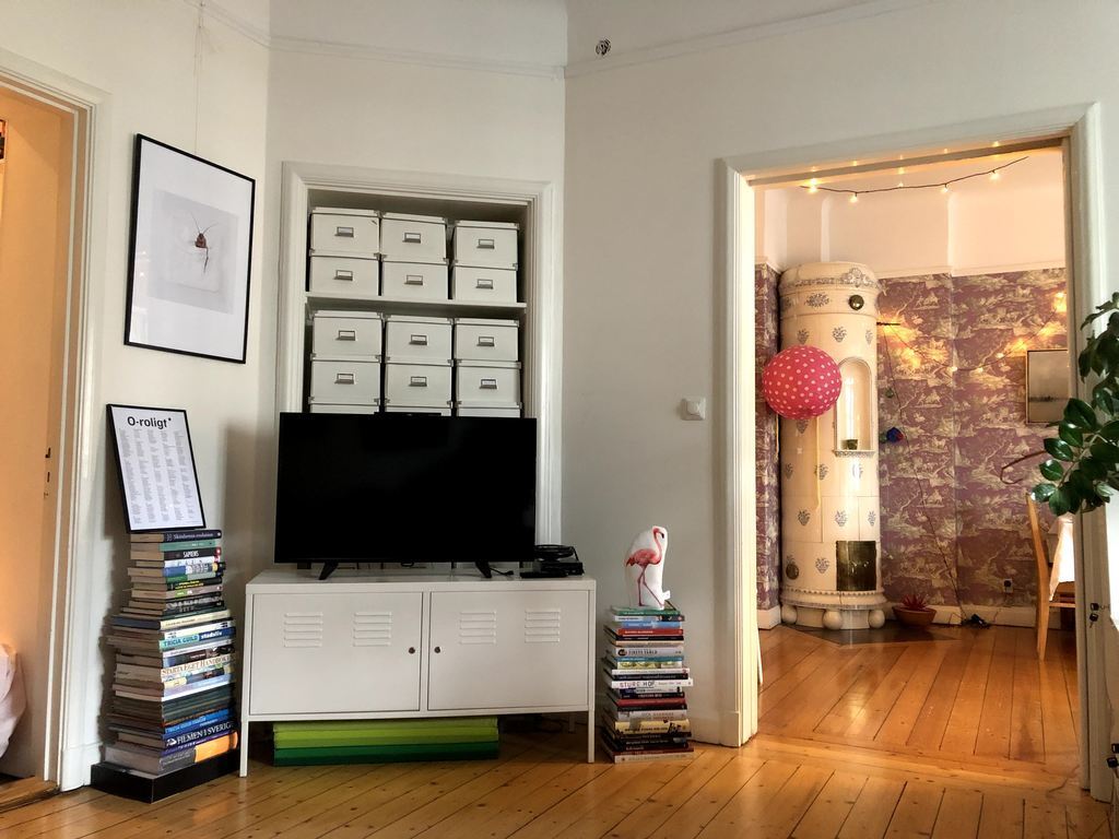 Tv seen from one of the sofas.