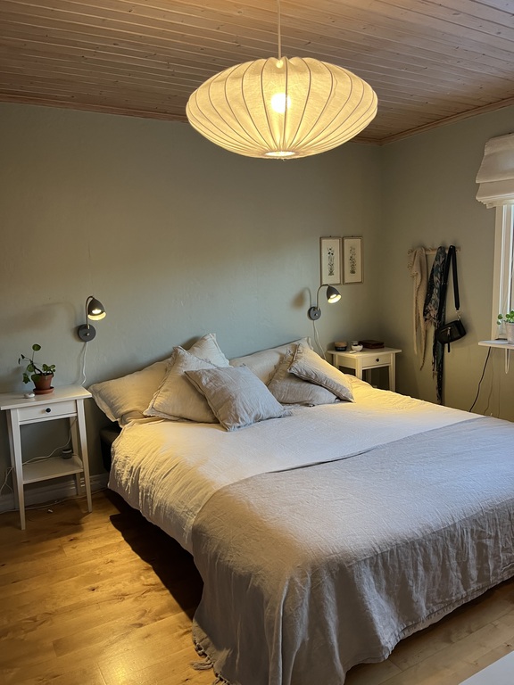 Master bedroom with double bed, desk with iMac, wardrobes