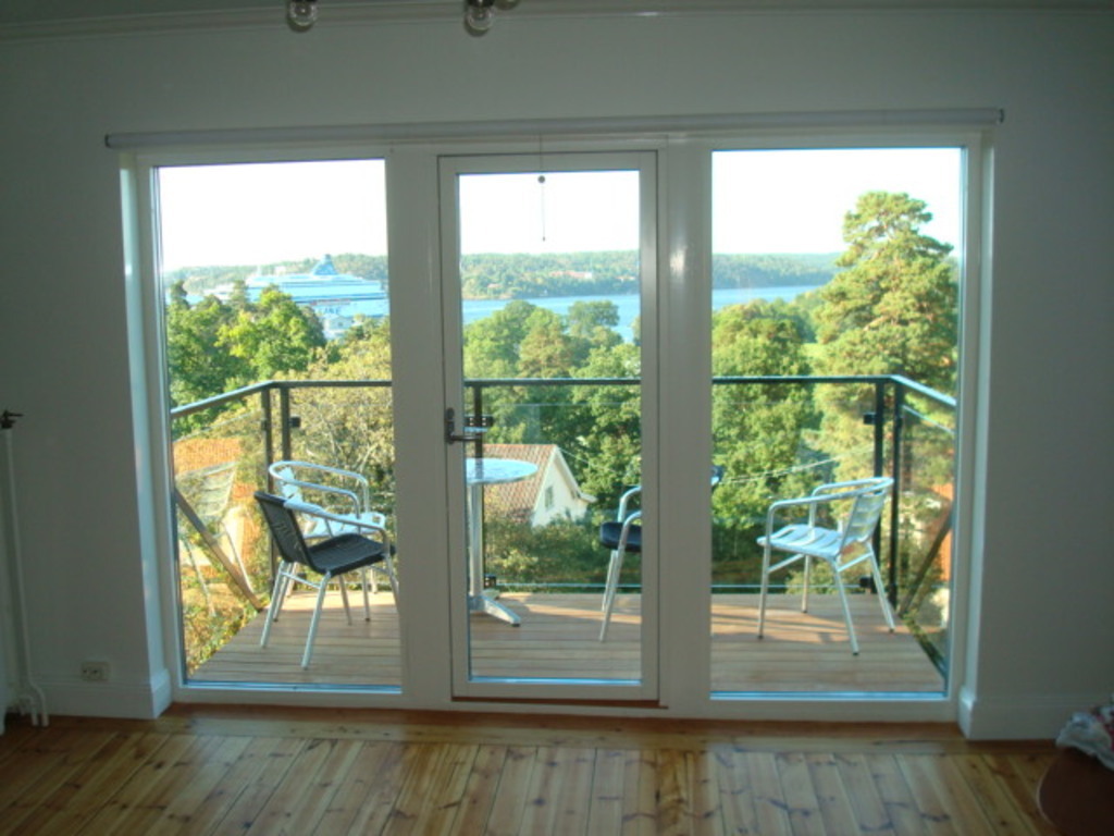 Master Bedroom with balcony view over inlet for boats from Finland, Baltics