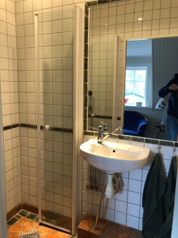 smaller bathroom third floor with toilet and shower