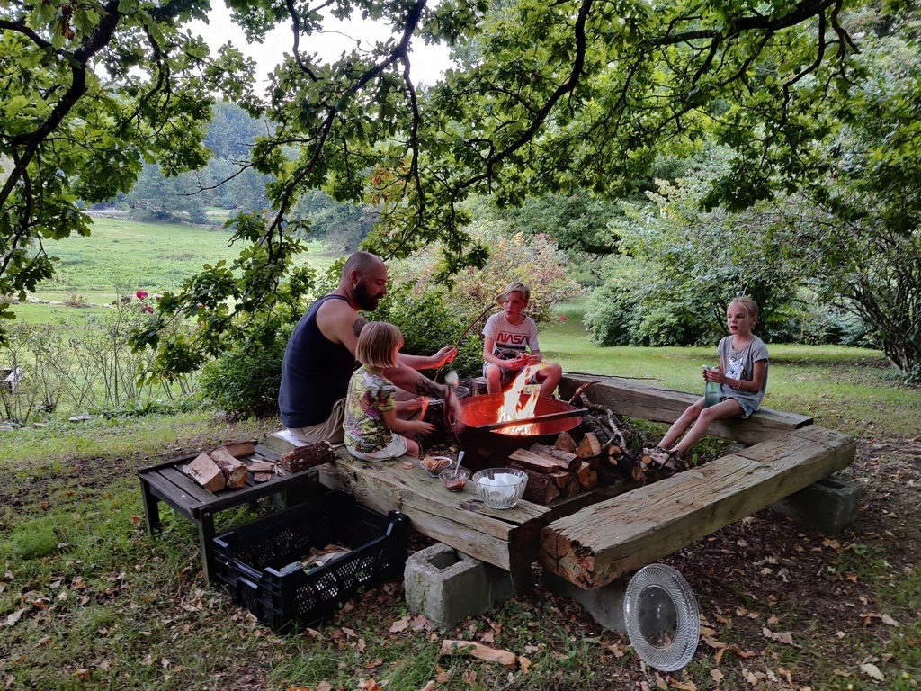 Bbq and fire place under the big oak in the garden. We also have a big gas grill. 