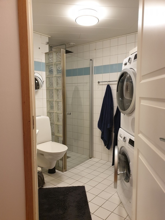 Bathroom with washer and dryer.