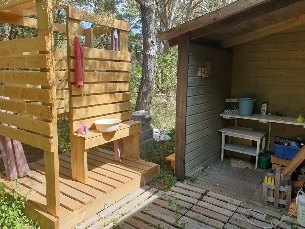 On the back side is the outdoor shower and washing area