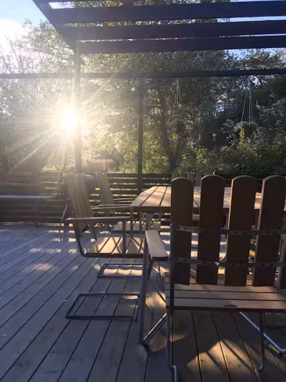 Terrace with table and chairs, plus a grill