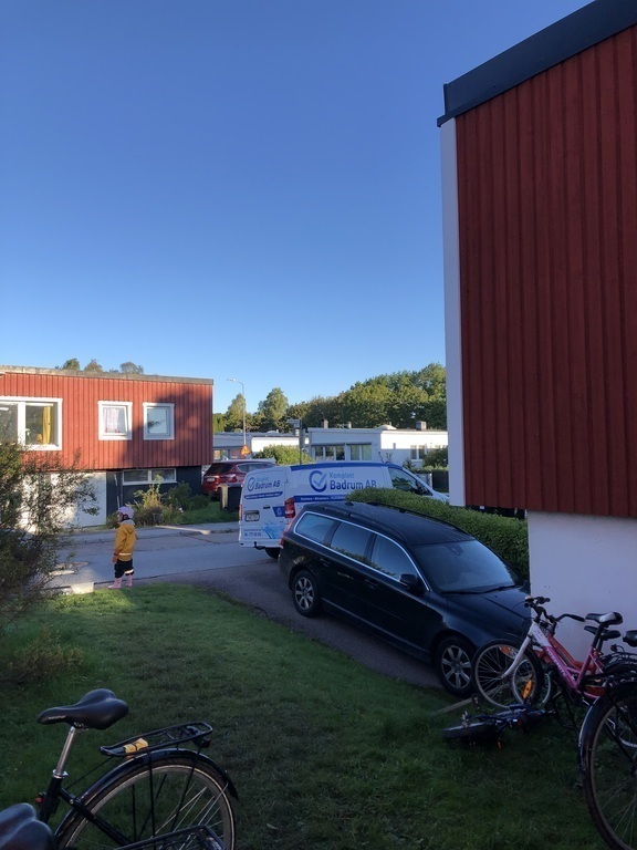 Our car and parking lot by the house