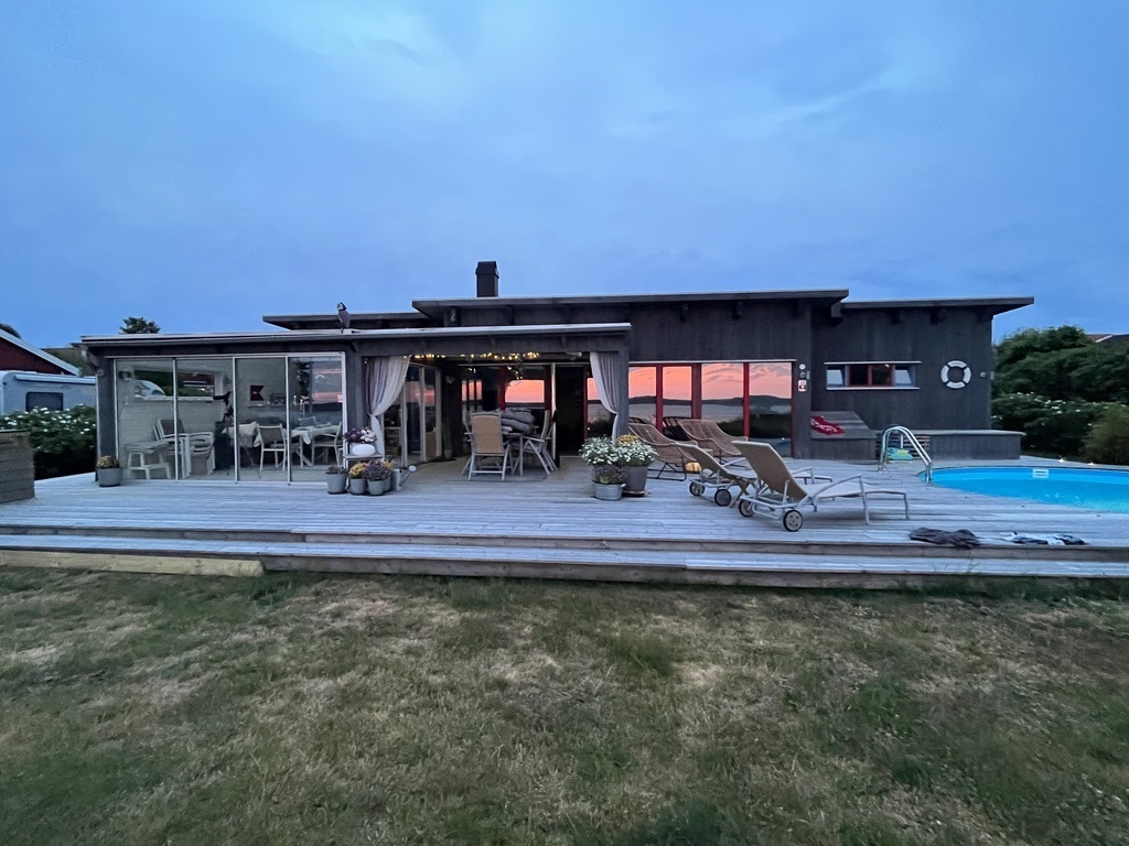 House and poolside at sunset
