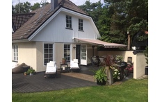 Sundeck with dining place and barbecue