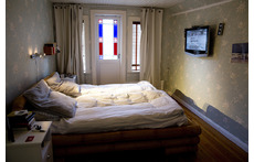 Bedroom upstairs with balcony.