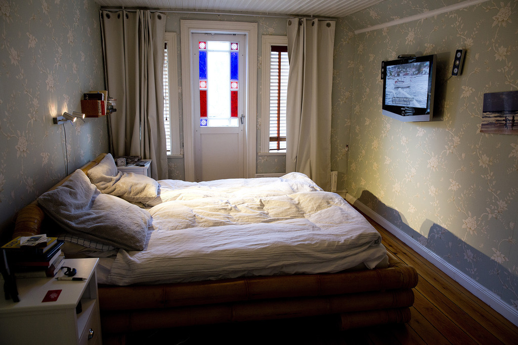 Bedroom upstairs with balcony.