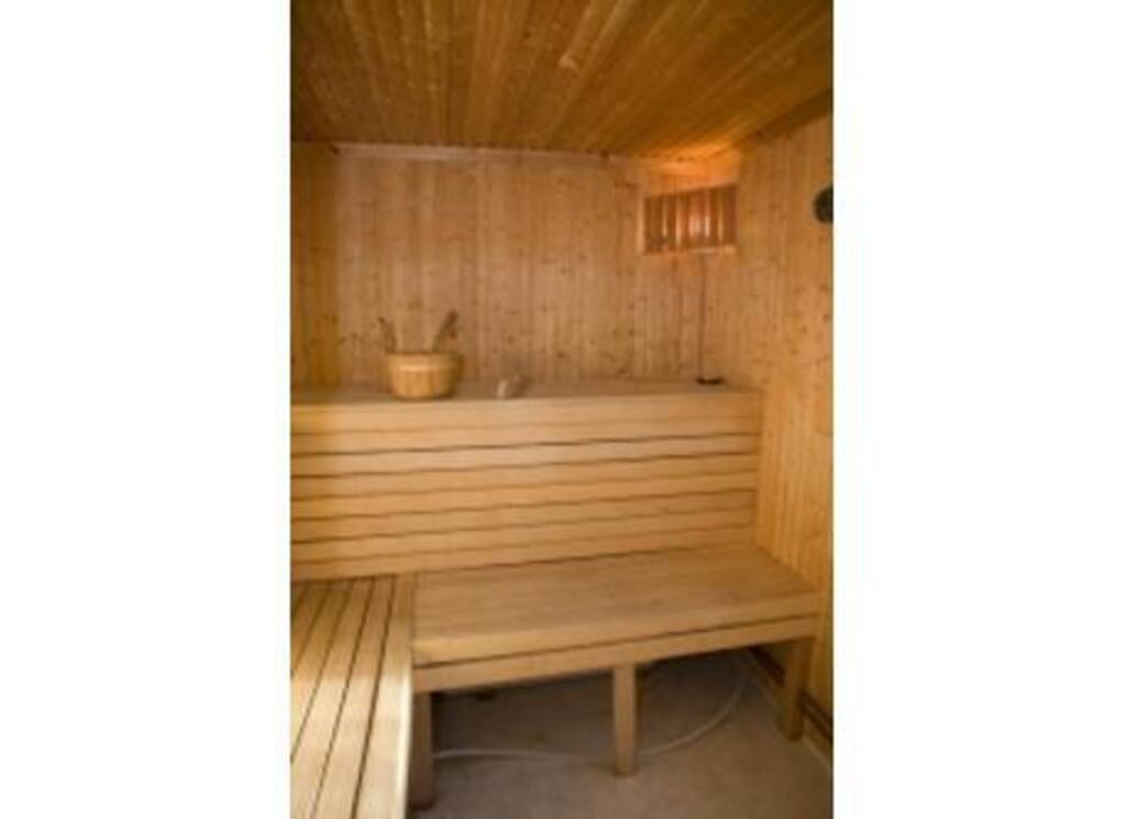 Swedish sauna with shower in an adjacent wooden cabin