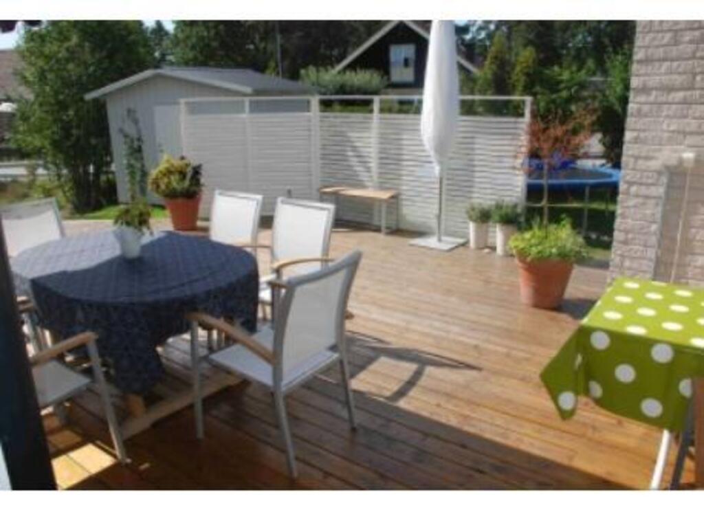 Wooden deck facing south/west, accessible from the kitchen