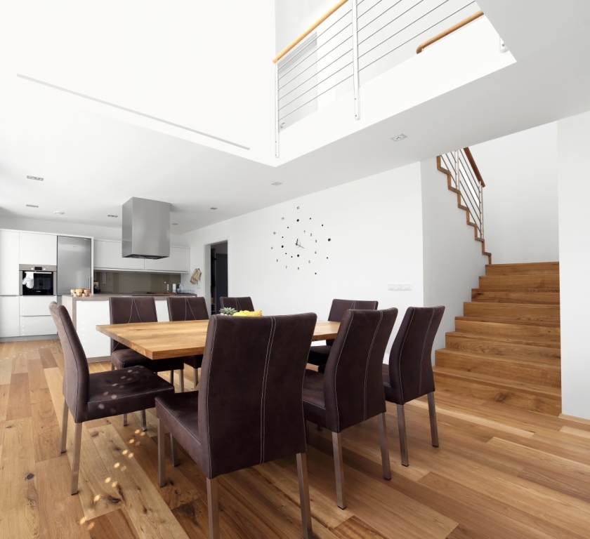 Dining table with gallery (that gives extra light) above it.