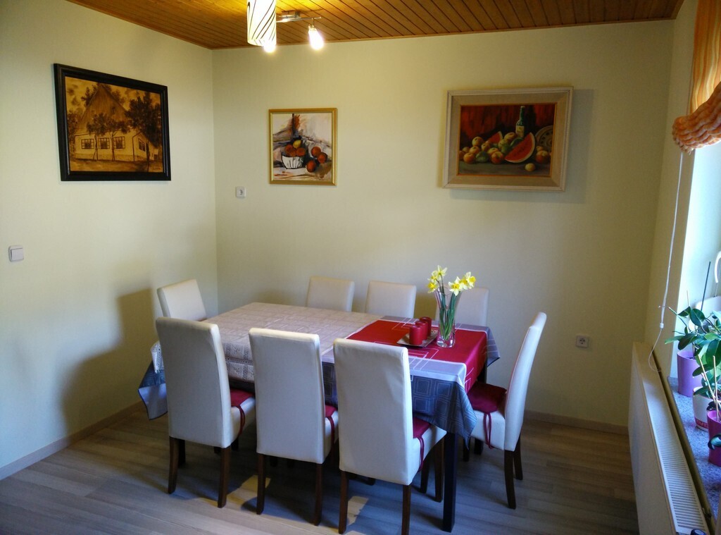 Lovely dinning room with big dinning table.