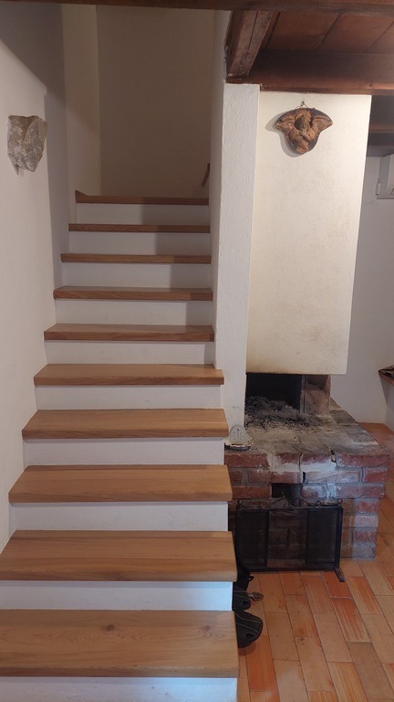 Open fire place and stairs to bedrooms