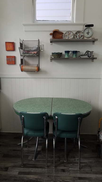Kitchen table. Despite the kitchen windows looking to the next building, loads of natural light enters the kitchen all day long.
