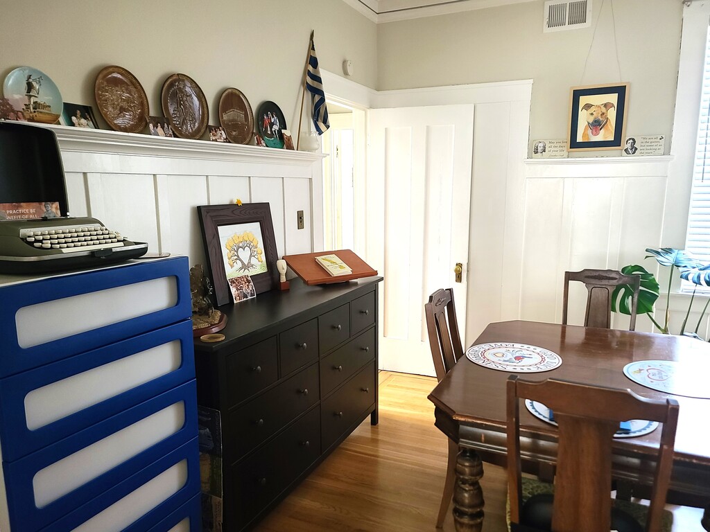 Dining room -- the blue-and-white dresser will be left empty for your use. The typewriter atop it is over 70 years old!