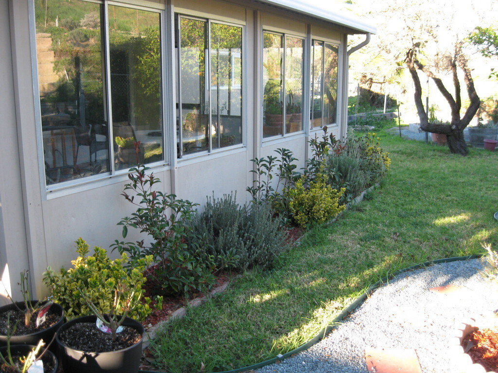 Behind the sun room.