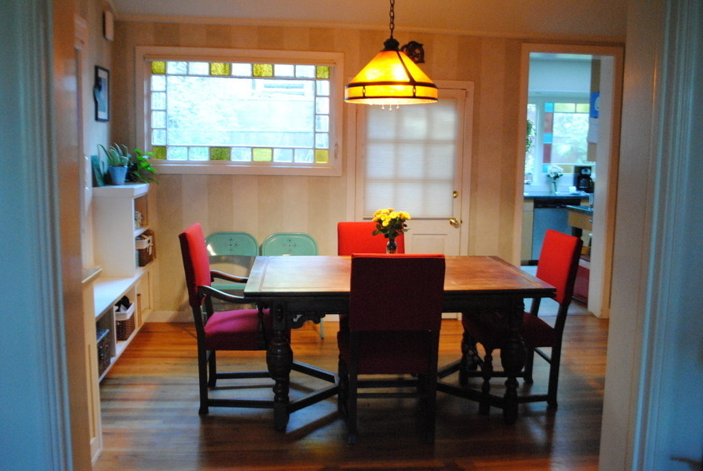 dining room looking into kitchen and back yard
