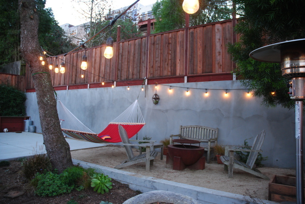 top of back yard, basketball court to the left,  hammock, fire-pit