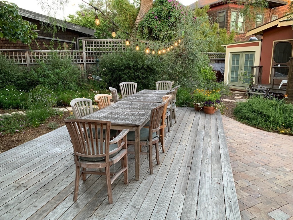 The communal table on the deck in the yard