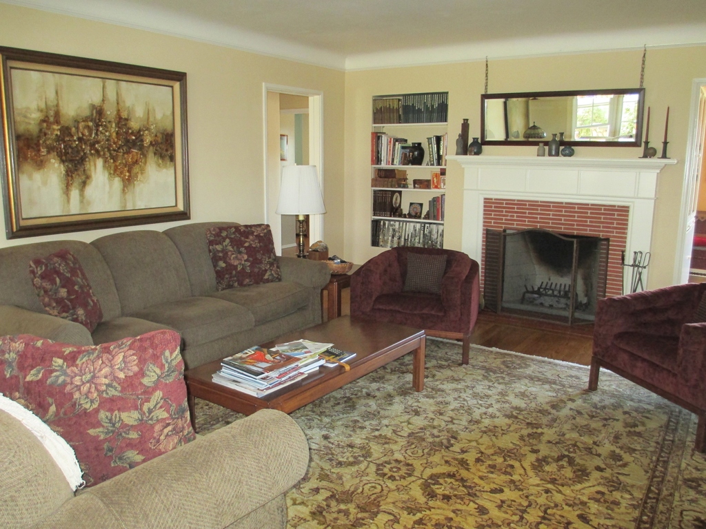 Living room with wood burning fireplace