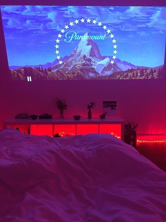 After a day of sightseeing, it's nice to lay in bed watching a film from the projector.