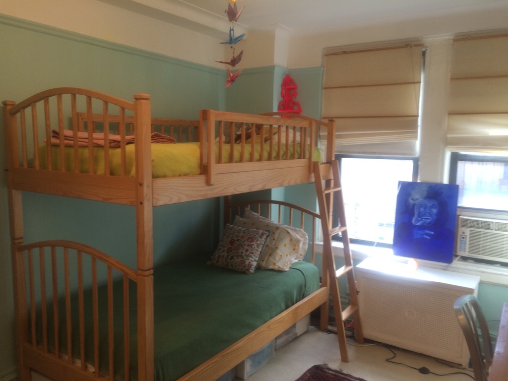 the kids room with comfortable bunk beds