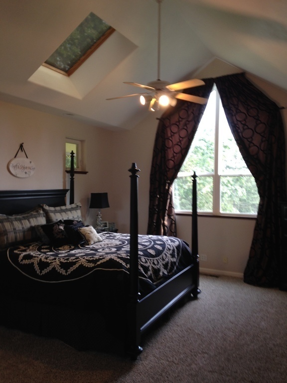 main level bedroom with king bed and ensuite