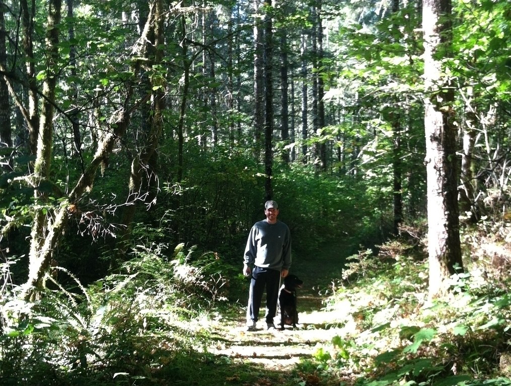 Gary hiking the trails behind our property