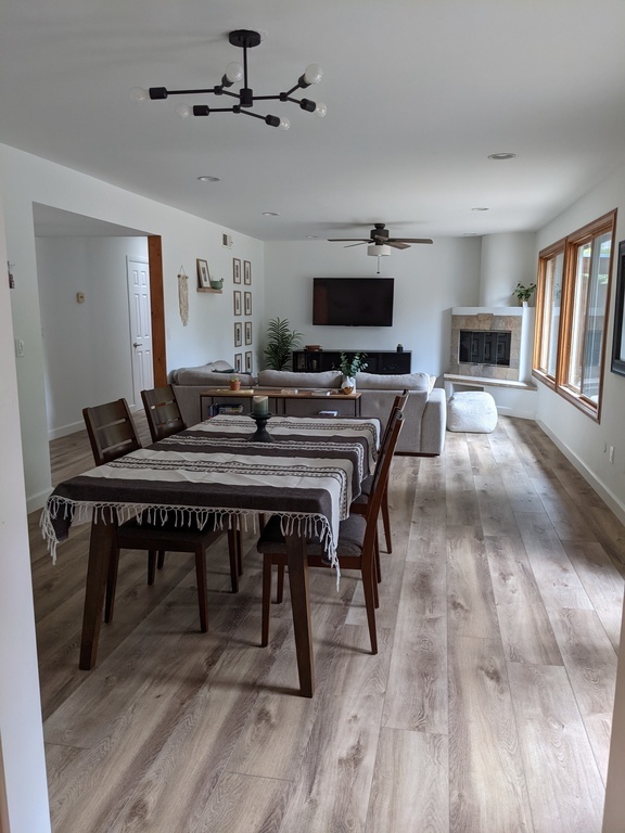 Walk thru from kitchen into dining area and third living space. 