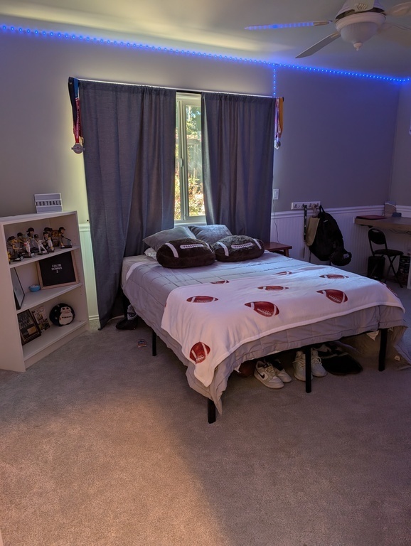 Our son's bedroom. Full size bed, desk, dresser and mirrored closet.