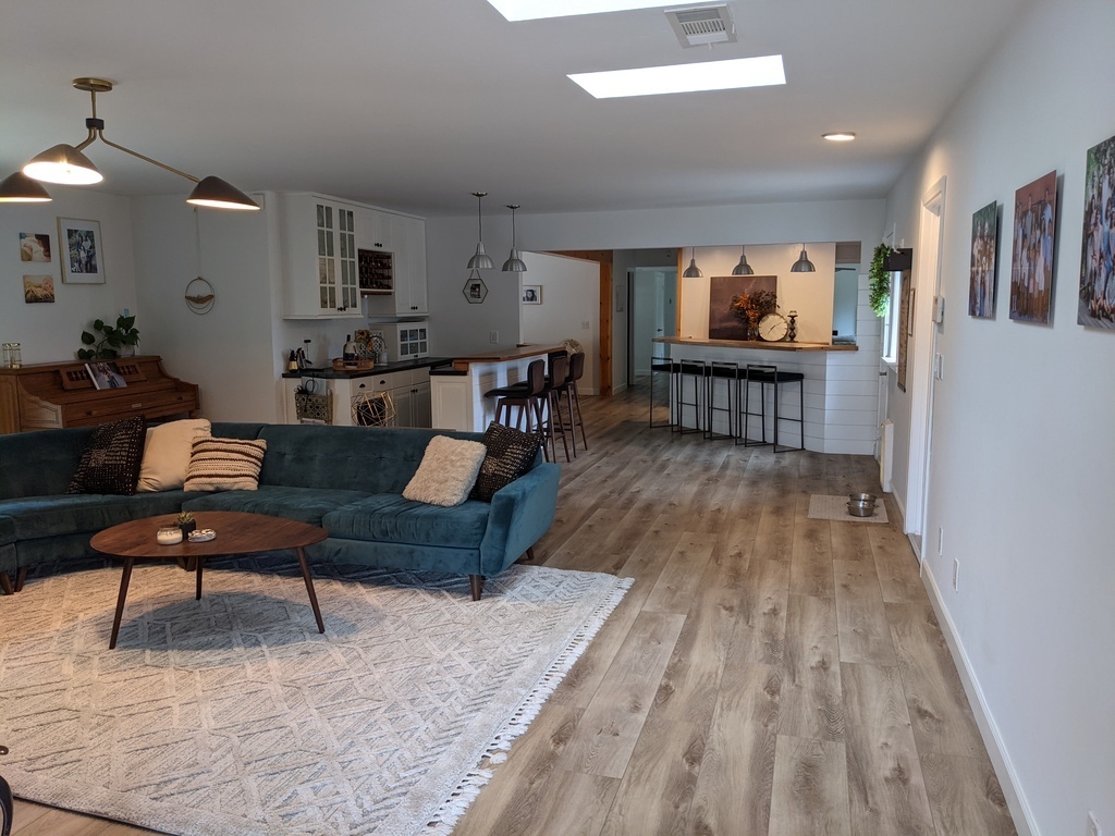 Entry through front door into first living space. Open concept floor plan with all bedrooms in the back of the house.